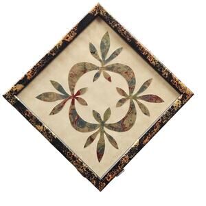 Cut paper art based on "Hickory Leaves and Orange Slices" Quilt Pattern Vermont